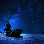 african-boatman-with-his-canoe-front-stars-1024×678